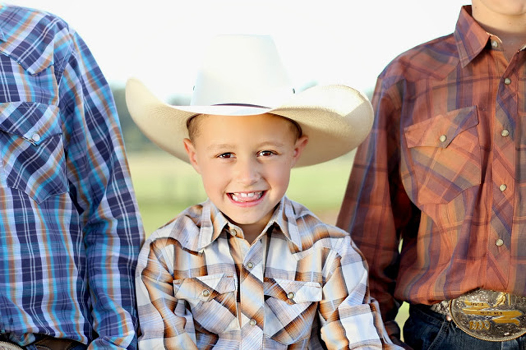 Carson Hickle in cowboy hat in the middle