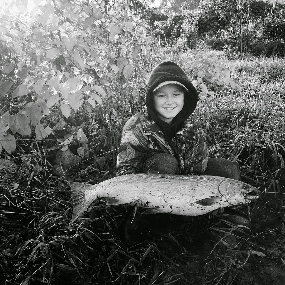 Cole with his first silver salmon in Washington state