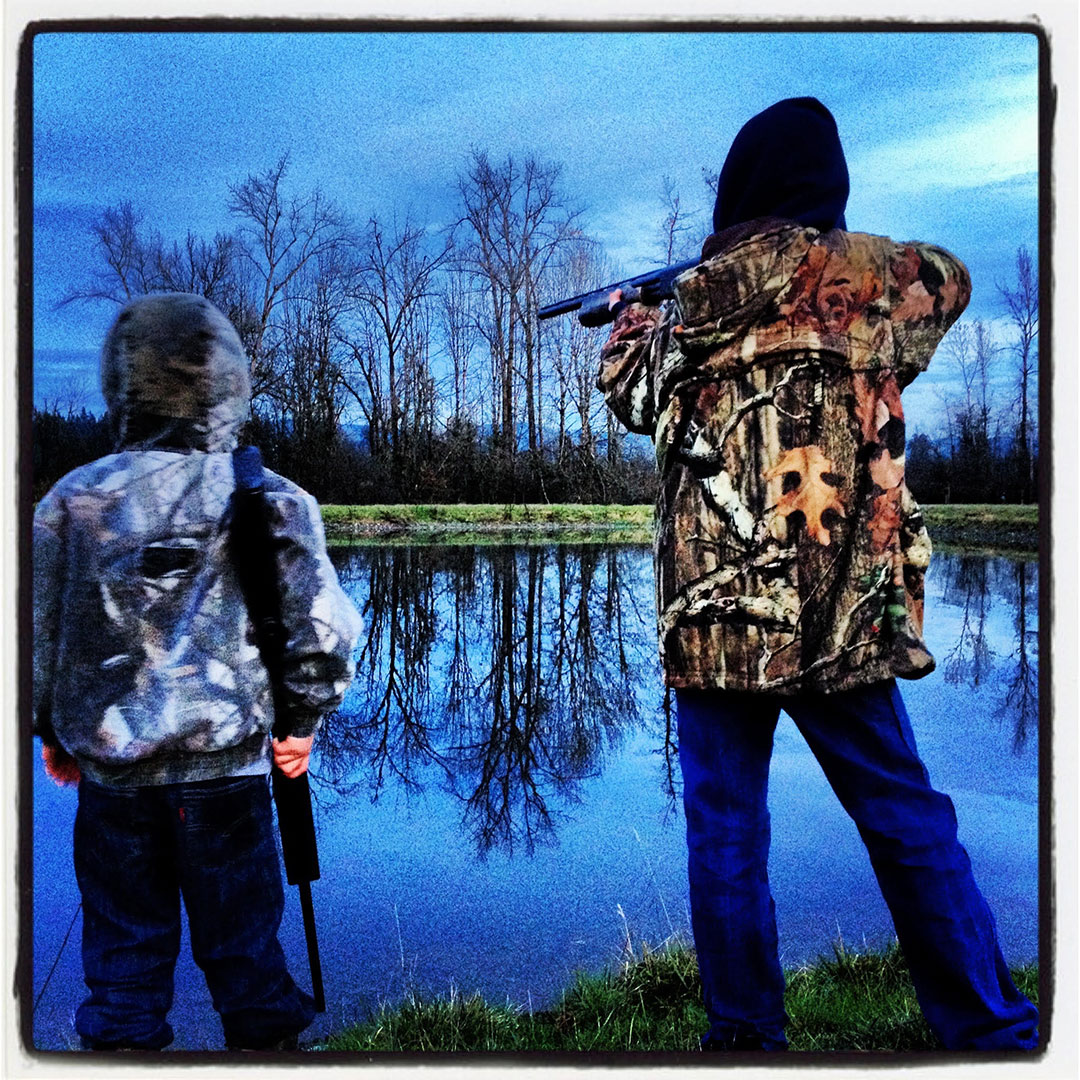 Cole and Carson duck hunting at the pond